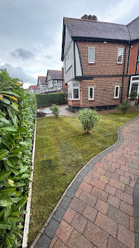Neatly maintained front garden lawn and borders